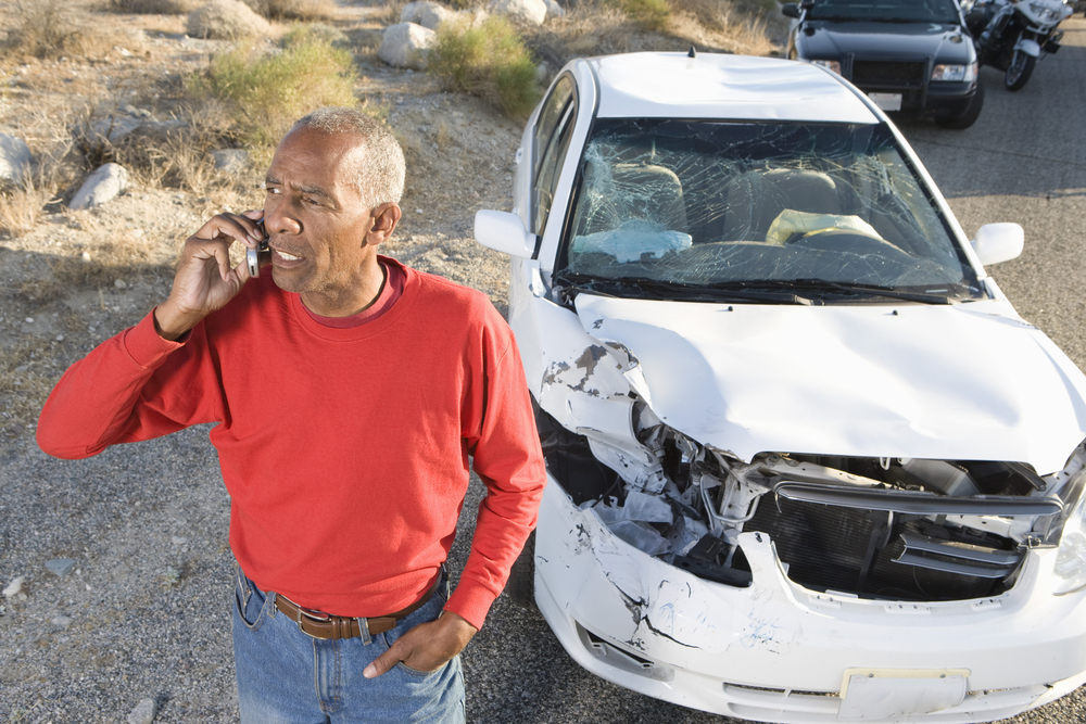 driver making call after car accident